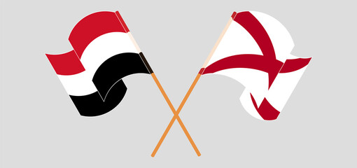 Crossed and waving flags of Yemen and The State of Alabama