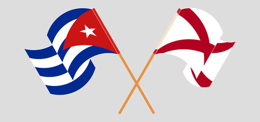 Crossed and waving flags of Cuba and The State of Alabama
