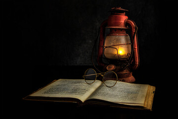 Color Studio Still Life Image of an Antique Lantern, Antique Book and Antique Spectacles 