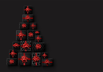 Black gift boxes with red bows like triangle Christmas tree.