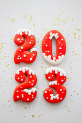 Banner for Christmas and New Year gingerbread cookies numbers 2023 on silk white background with...
