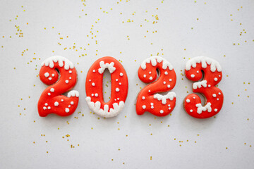 Banner for Christmas and New Year gingerbread cookies numbers 2023 on silk white background with...