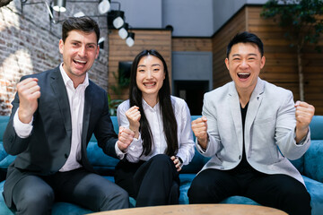 Euphoria excited business team celebrating corporate victory together in the office, happy group of...