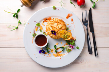 fried cutlet with almonds and orange