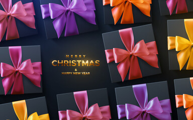 Merry Christmas and Happy New Year golden sign. Black gift boxes with colorful ribbons and bows on black background.