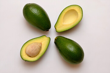 fresh cut avocado fruit on white background, flat lay