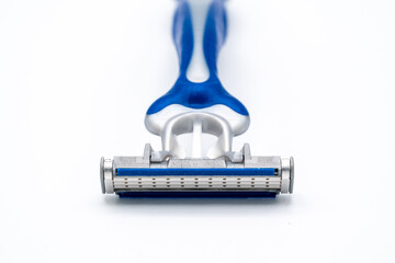 triple blade razor head in blue and gray colors on light background