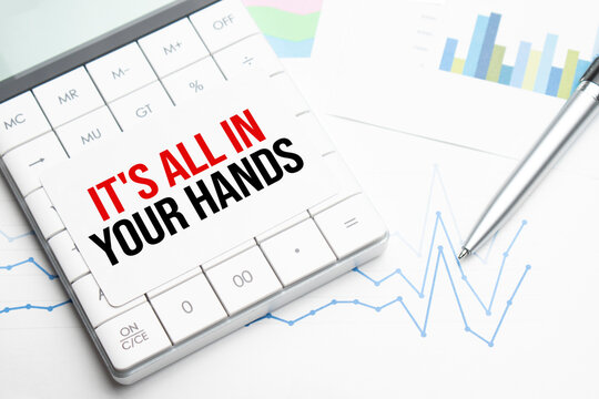 Text It is all in your hands Calculator, pen and charts, documents and graphs. Business and tax concept on white background. Top view.