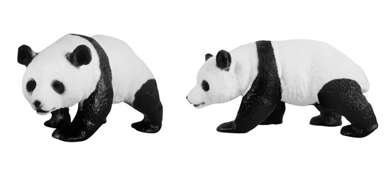Isolated photo of plastic small panda bear toy figurine on white background. © breakermaximus