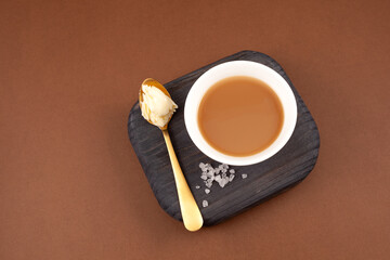 Butter tea or churned tea, top view. Traditional Tibetan chai or Asian drink known as 