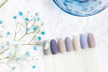 Different color nails polish manicure palette Background.