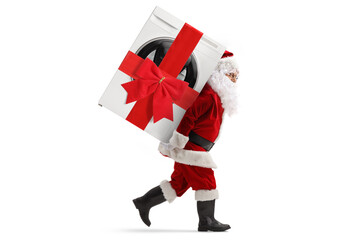 Full length profile shot of santa claus carrying a wrapped washing machine with a ribbon on his back