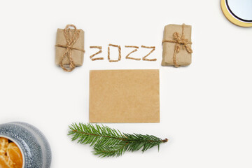 Blank eco card. Happy New year 2022. New Year Concept welcoming New Year 2022 written by craft rope...