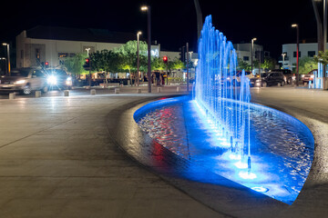 Fountain with blue illumination on the street of night Paphos