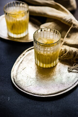 Vodka cocktail with lemon in glasses