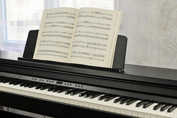 Piano keys, sheet music. electronic piano at a music school. . High quality photo
