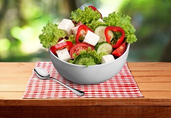 Healthy Homemade vegetables Salad in the bowl on a desk