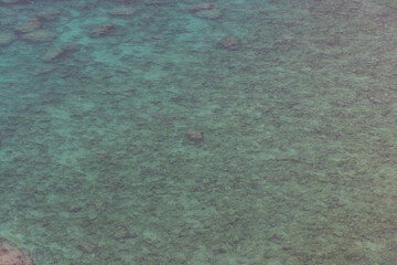 a clean sea and rocks in it