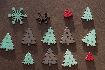 retro christmas wooden decorations on paper - photographed with descriptive, raking or low light