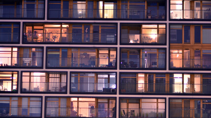 Modern apartment house building architecture concept. Outdoor residential home facilities. At night