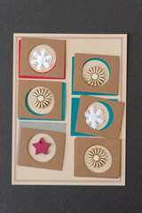 paper background with christmas elements (snowflakes, star, and florals)