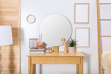 Modern wooden dressing table with mirror and decorative elements in room