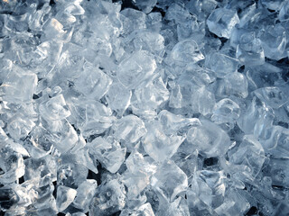 Crushed ice cubes on black background.