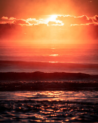 Hazy sunrise and waves on Lake Superior