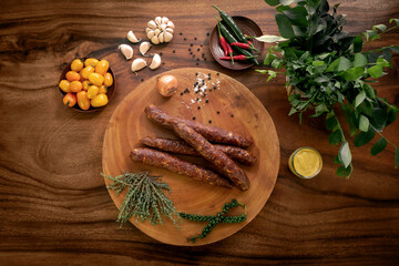 Fototapeta premium spanish chorizo sausages on rustic wood table with natural ingredients