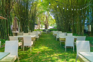 empty wicker table and chair in outdoor restaurant