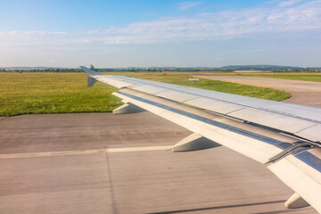 View from the airplane window during taking off on a clear summer morning. Yekaterinburg, Russia