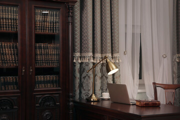 Library reading room interior with wooden bookcase and table near window