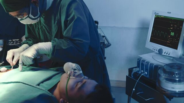 Medical surgical doctor team performing surgery patient, Group surgeon at work on operating room with electrocautery equipment for cardiovascular emergency surgery center in hospital