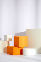 Front view of white and orange podium with in a white background for advertising , abstract content