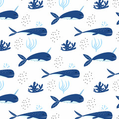 Childrens seamless pattern with blue whales. Patter with cute whale and narwhal. Suitable for fabrics, wrapping papers and prints.