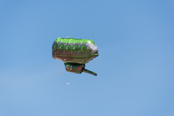 Tank toy (balloon) flew into the sky. The inscription on the tank in Russian: T-43 (for the homeland).