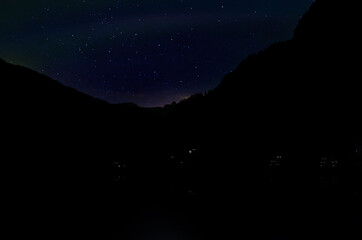 Fototapeta na wymiar Beautiful view of starry sky over mountains at night