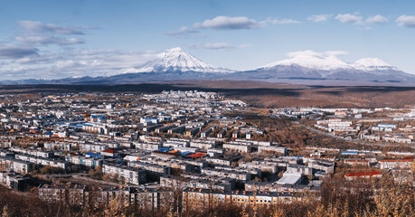 Fototapeta na wymiar Capital of Kamchatka Petropavlovsk-Kamchatsky city view with volcano peaks on the horizon