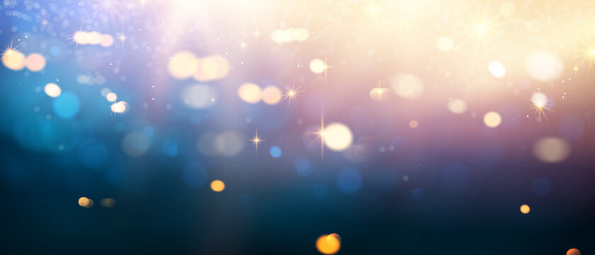 Beautiful gold and blue glitter stars on black blue abstract background are used for celebrations.