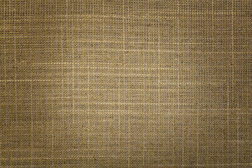 Texture of natural burlap fabric as background, top view. Vignette effect