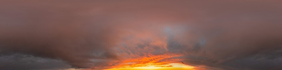 Red burning sunset sky panorama with Cumulus clouds. Seamless hdr 360 pano in spherical...