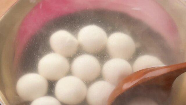 Boiling traditional big delicious tangyuan for Winter Solstice Festival food