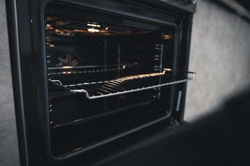 Home oven in the interior. Grill rack in the home oven.