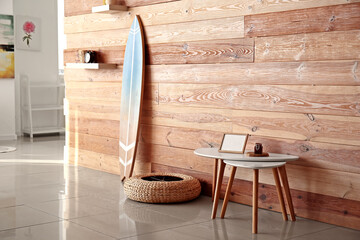 Interior of stylish modern room with surfboard