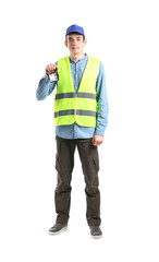 Young male worker with flashlight on white background