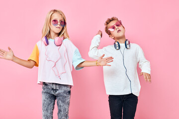 adorable little kids blonde hair fashionable glasses Listening music