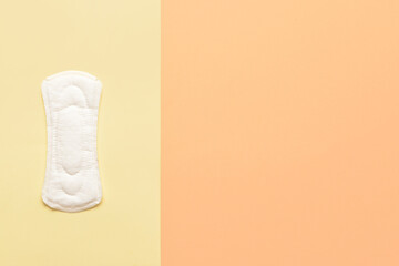 Menstrual pad on yellow background