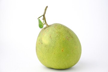 green pomelo with leaves isolated on white background