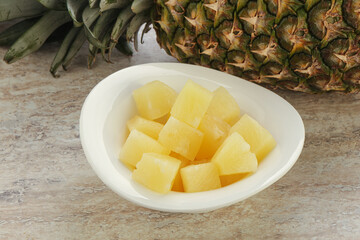 Marinated pineapple slices in the bowl