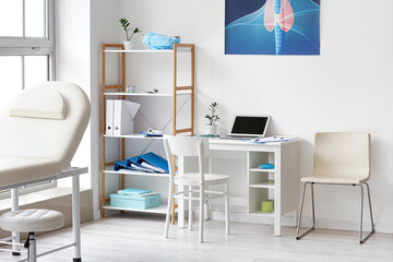 Doctor's workplace with laptop in medical office